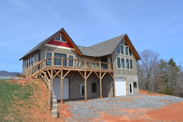 Exterior of home with gravel driveway